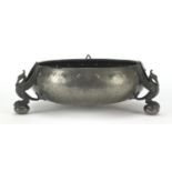 English pewter bowl with bird of paradise supports and planished decoration, 22cm in diameter