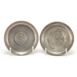 Pair or silver dishes inset with 1917 Indian rupees comprising one unmarked and one impressed "