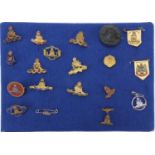 Nineteen British military Royal Artillery brooches including enamel, jet and silver examples