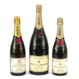 Three bottles of Moet & Chandon Champagne including a magnum example