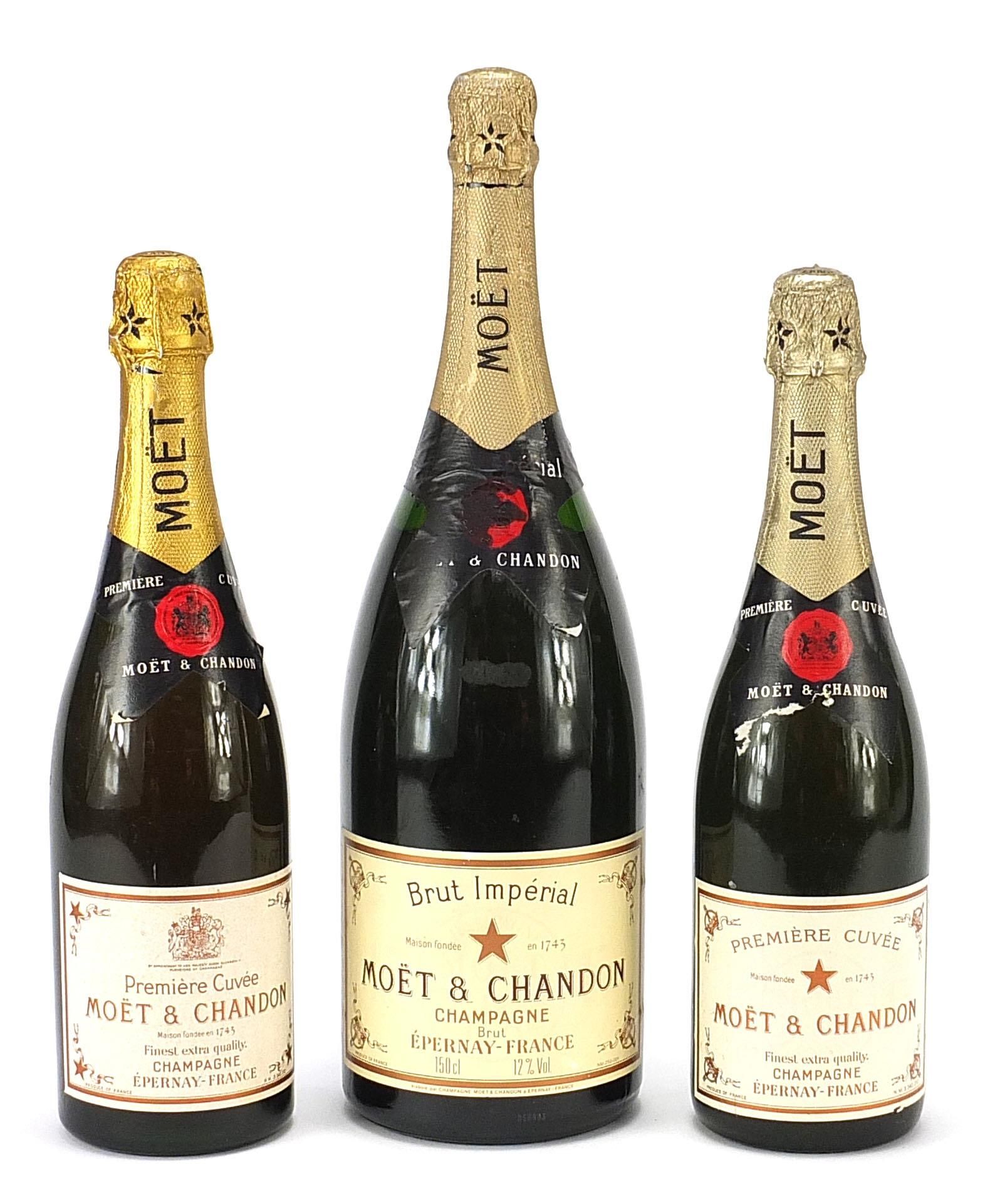 Three bottles of Moet & Chandon Champagne including a magnum example