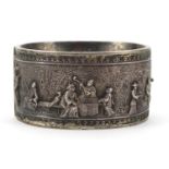 Heavy sterling silver hinged bangle, relief decorated with figures in a cathedral, 6.5cm wide, 70.5g