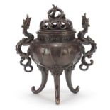 Chinese patinated bronze tripod koro with dragon handles, 22cm high