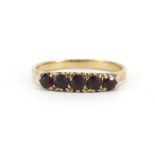 9ct gold garnet five stone ring, size O, 1.9g