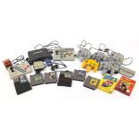 Nintendo 64 games console and accessories including five controllers, Super Advantage joystick,