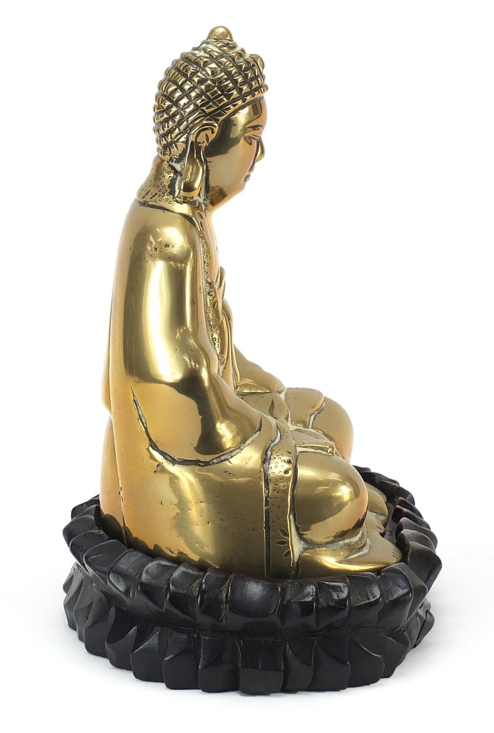 Chinese bronzed figure of Buddha raised on a carved hardwood lotus stand, 23.5cm high - Image 5 of 7