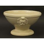 White glazed ceramic water feature with masks, 20cm high x 35cm in diameter