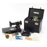 Vintage Singer black enamel sewing machine with case and accessories, model 222K