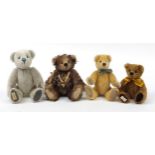 Four Deans Rag Book teddy bears with articulated arms and legs, the largest 30cm high