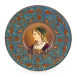 Austrian pottery charger hand painted with young lady wearing necklaces, 33cm in diameter