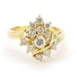 18ct gold diamond cluster ring, the central diamond approximately 3mm in diameter, size M, 5.6g