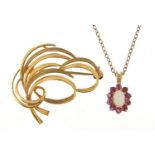 9ct gold opal and ruby pendant on a gold coloured metal necklace and a 9ct gold brooch, the brooch