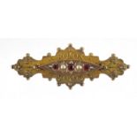 Victorian 9ct gold garnet and seed pearl mourning brooch, 4.5cm wide, 3.8g