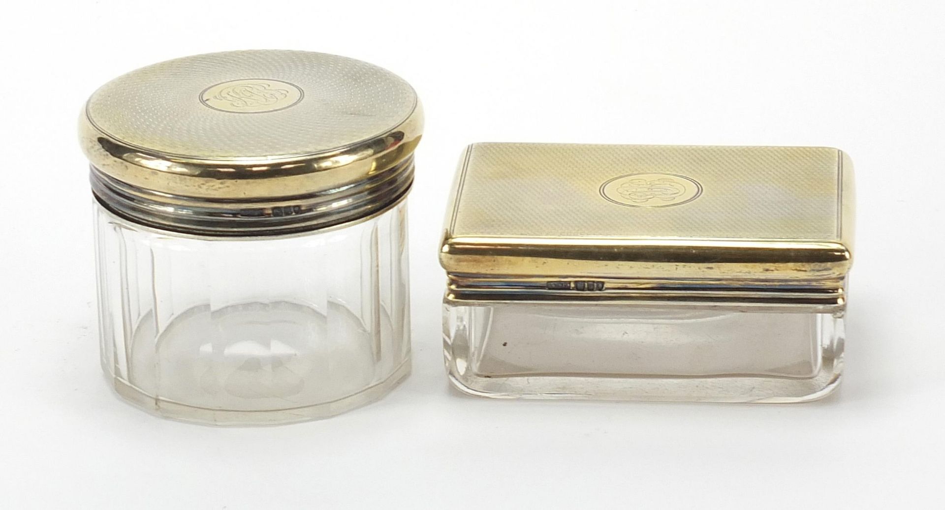 Asprey, two cut glass jars with silver gilt lids and engine turned decoration, the largest 9cm wide - Image 2 of 5