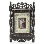 Chinese hardwood screen with mother of pearl inlay housing a black and white photograph of a