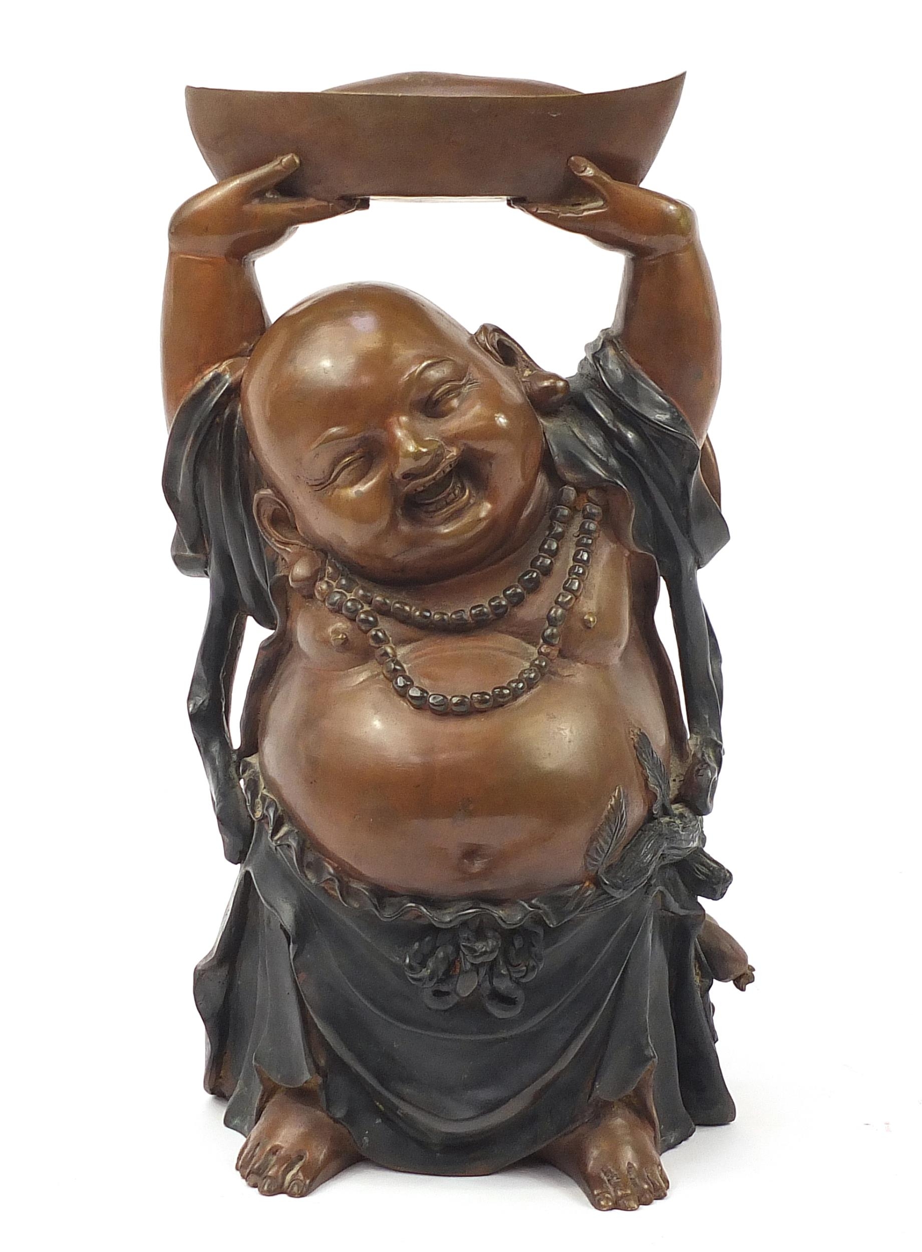 Large Chinese patinated bronze figure of Buddha with his hands above his head holding a vessel, 48cm