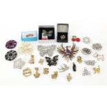 Collection of costume jewellery brooches, including some jeweled and enamel animals