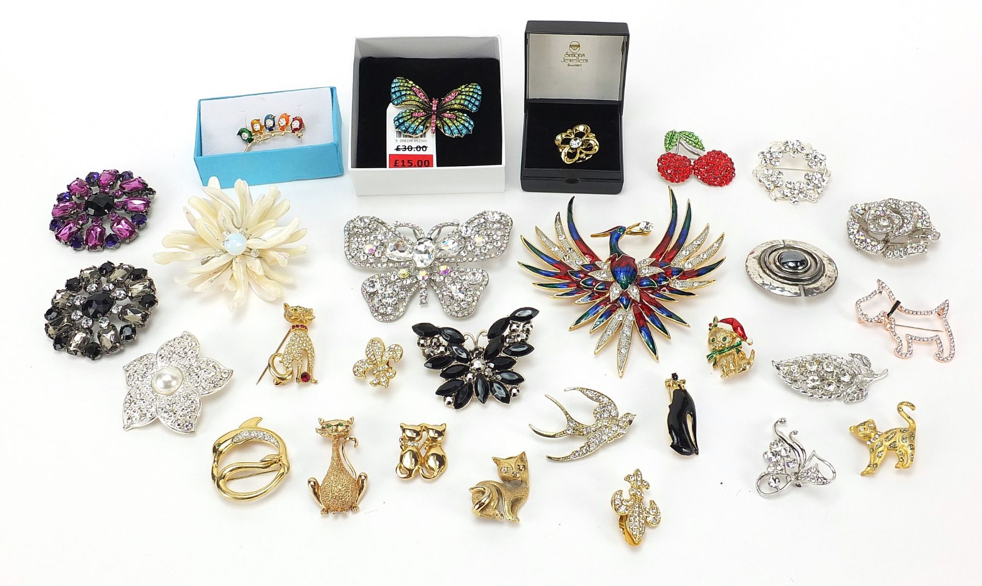 Collection of costume jewellery brooches, including some jeweled and enamel animals