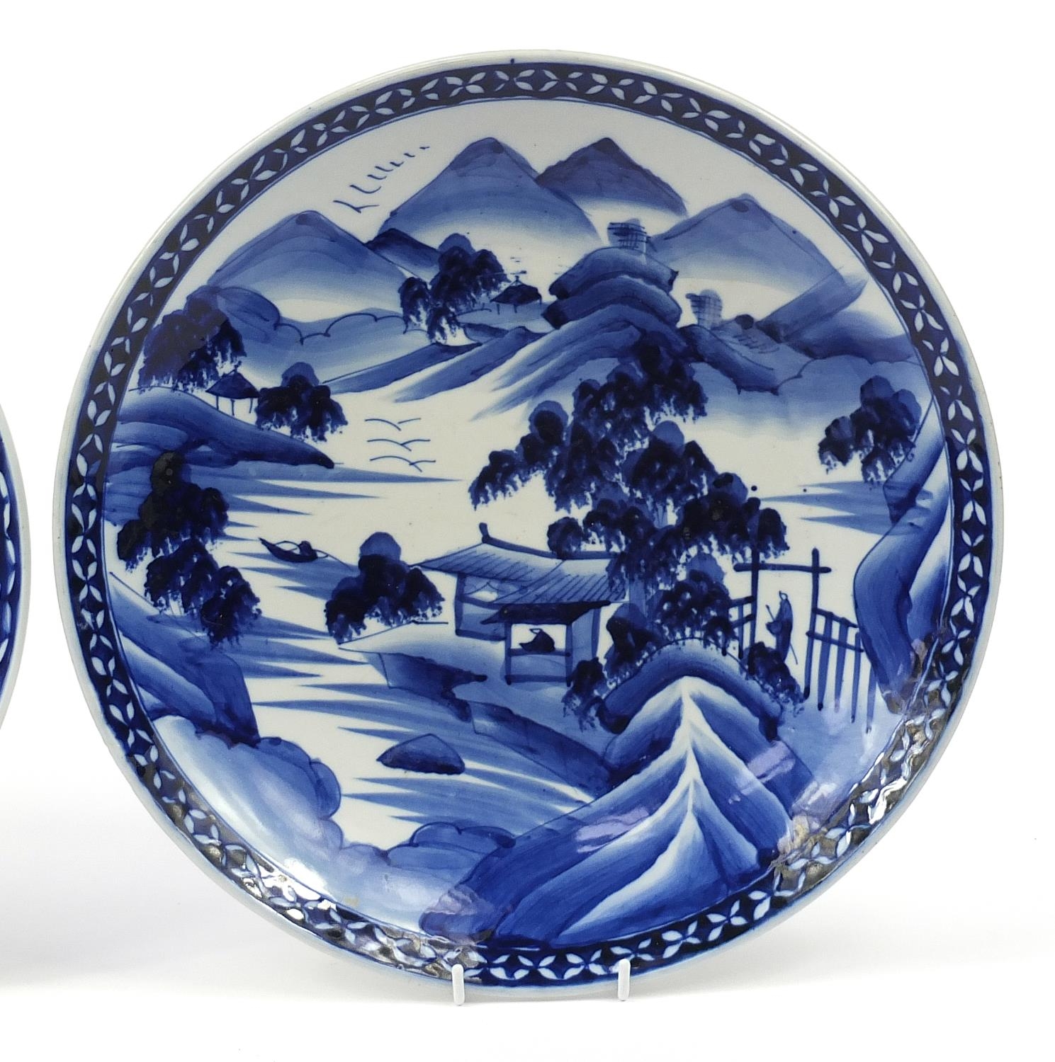 Two Japanese blue and white porcelain chargers, hand painted with mountainous landscapes, the - Image 3 of 7
