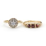 Two 9ct gold rings comprising three stone garnet and clear stone cluster, sizes N and P, 4.7g