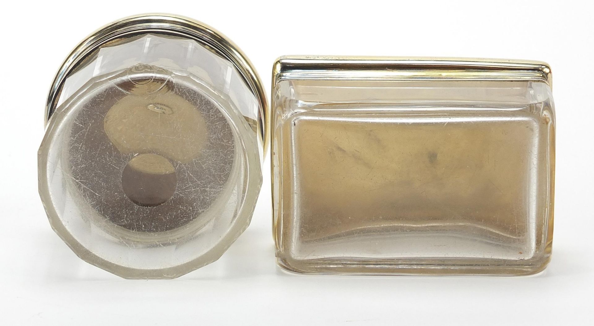 Asprey, two cut glass jars with silver gilt lids and engine turned decoration, the largest 9cm wide - Image 4 of 5