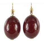 Pair of amber coloured bead earrings with gold coloured metal mounts, 3.5cm high, 10.4g