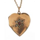 9ct gold back and front love heart locket set with a garnet and seed pearls on a 9ct gold