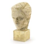 Carved concrete sculpture of a head mounted onto a square plinth, 37cm high