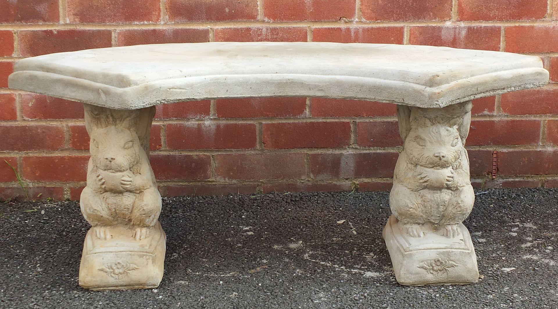 Stoneware garden bench with squirrel supports, 43cm high x 103cm wide