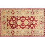 Indian hand woven beige and red ground rug, 250cm x 153cm wide