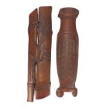 Two Chinese carved bamboo scholar's wrist rests including one in the form of a vase with