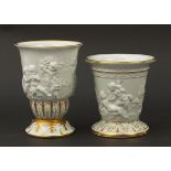 Two Italian hand gilded porcelain vases relief decorated with Putti, the largest 17.5cm high