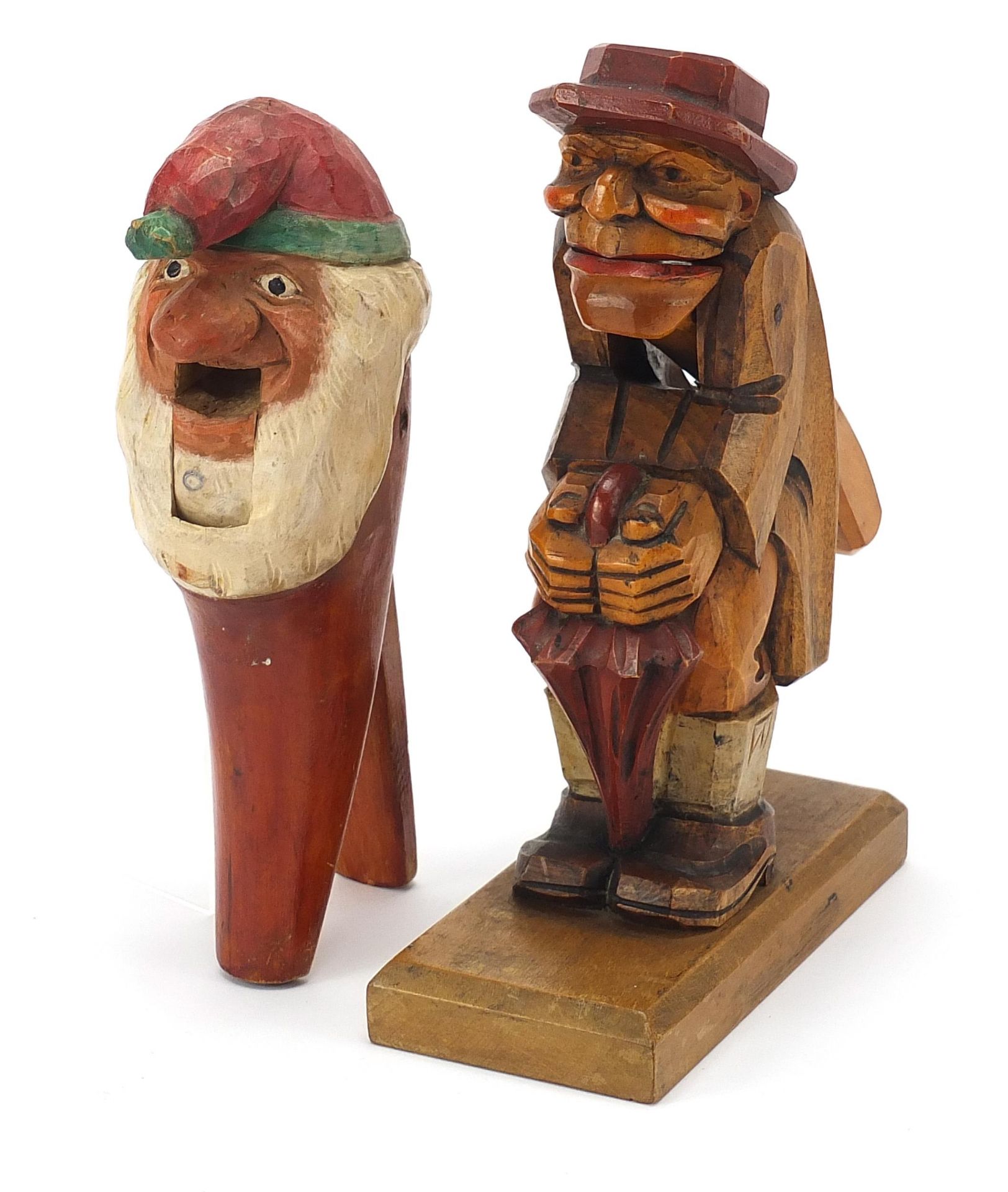 Two carved Black Forest nutcrackers including one in the form of a gnome, the largest 23cm high