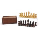 Carved hardwood Staunton pattern chess set with case, the largest pieces each 9.5cm high