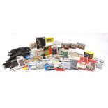 Collection of model railway track and accessories including buildings and Airfix mineral wagons with