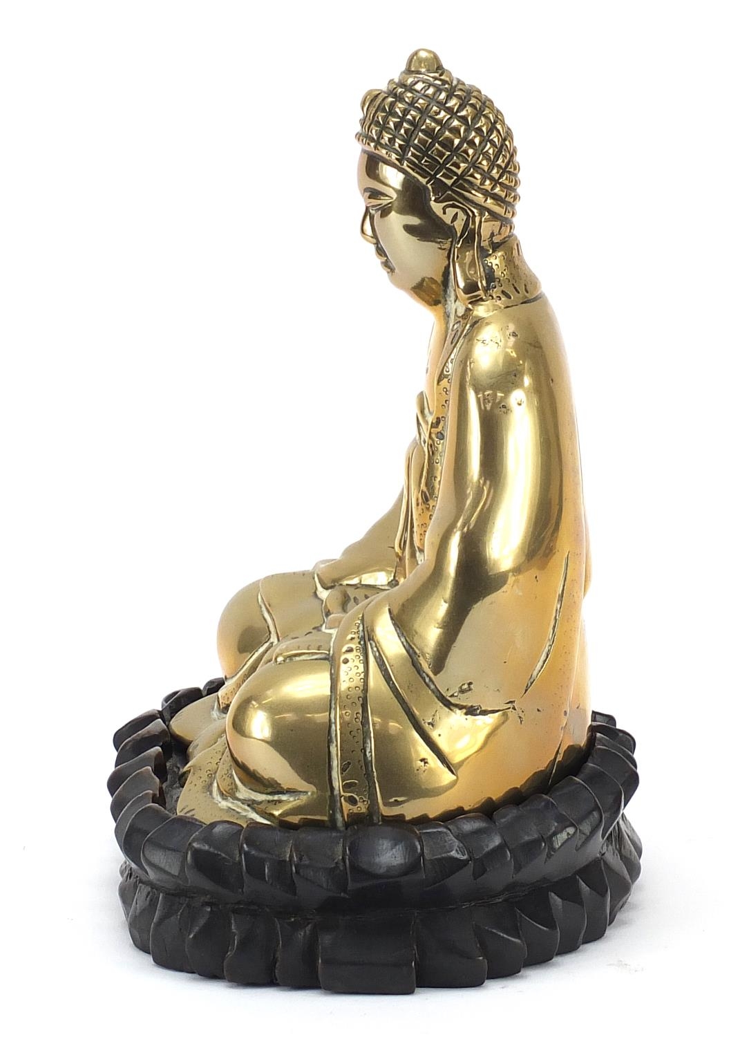 Chinese bronzed figure of Buddha raised on a carved hardwood lotus stand, 23.5cm high - Image 3 of 7