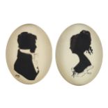 Pair of hand painted oval silhouette portraits signed Ray, housed in ebonised frames, each 8.5cm x