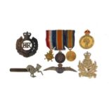 Militaria to include badges, dress medals with ribbons, silver RAF wings sweet heart brooch and