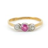 18ct gold ruby and diamond three stone ring, size O/P, 2.0g