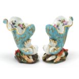 Pair of continental porcelain shell vases hand painted with flowers, each 13cm high