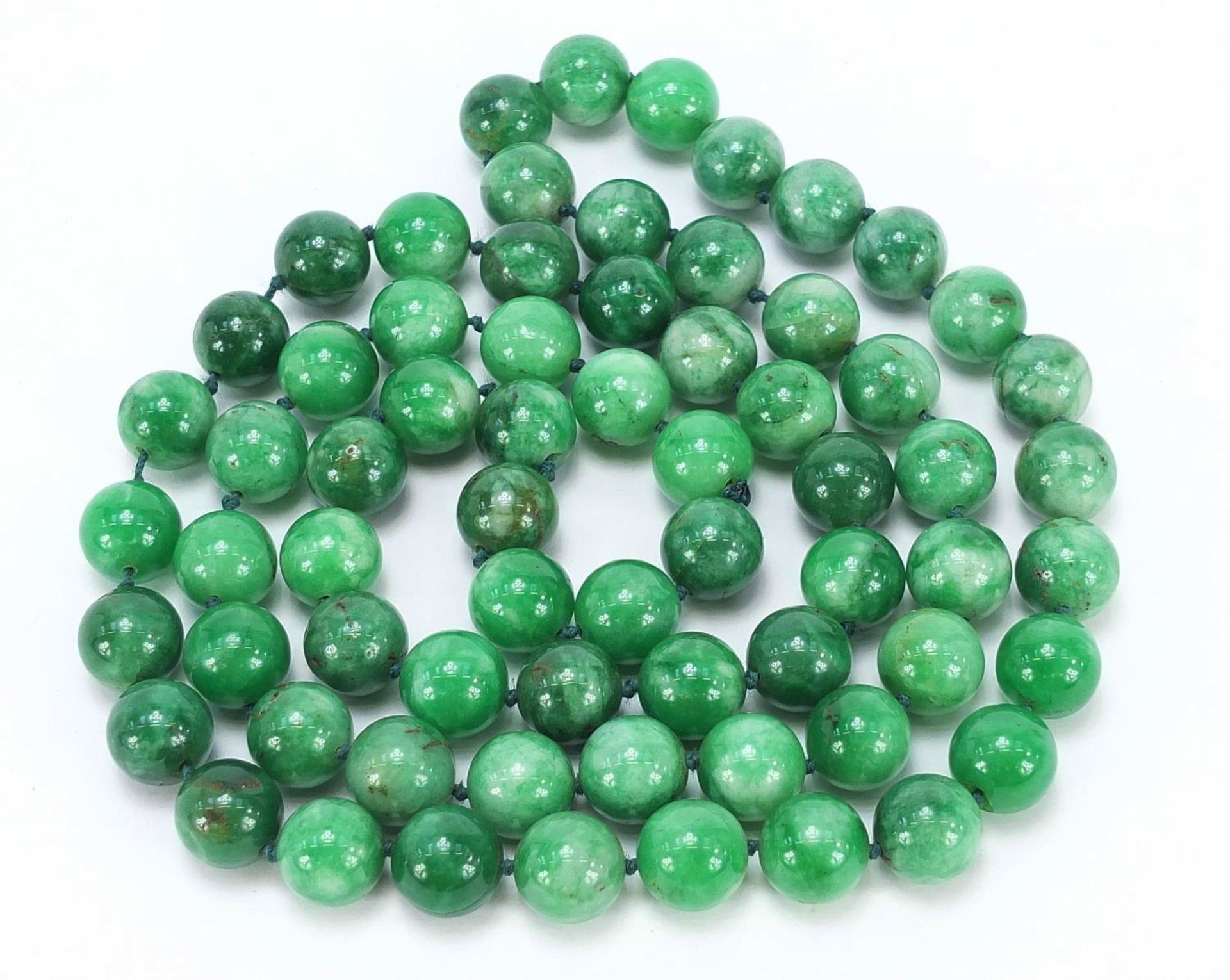 Chinese green hardstone bead necklace, possibly jade, each bead approximately 1.5cm in diameter, - Image 2 of 3