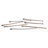 Seven vintage and later violin bows including examples with mother of pearl frogs