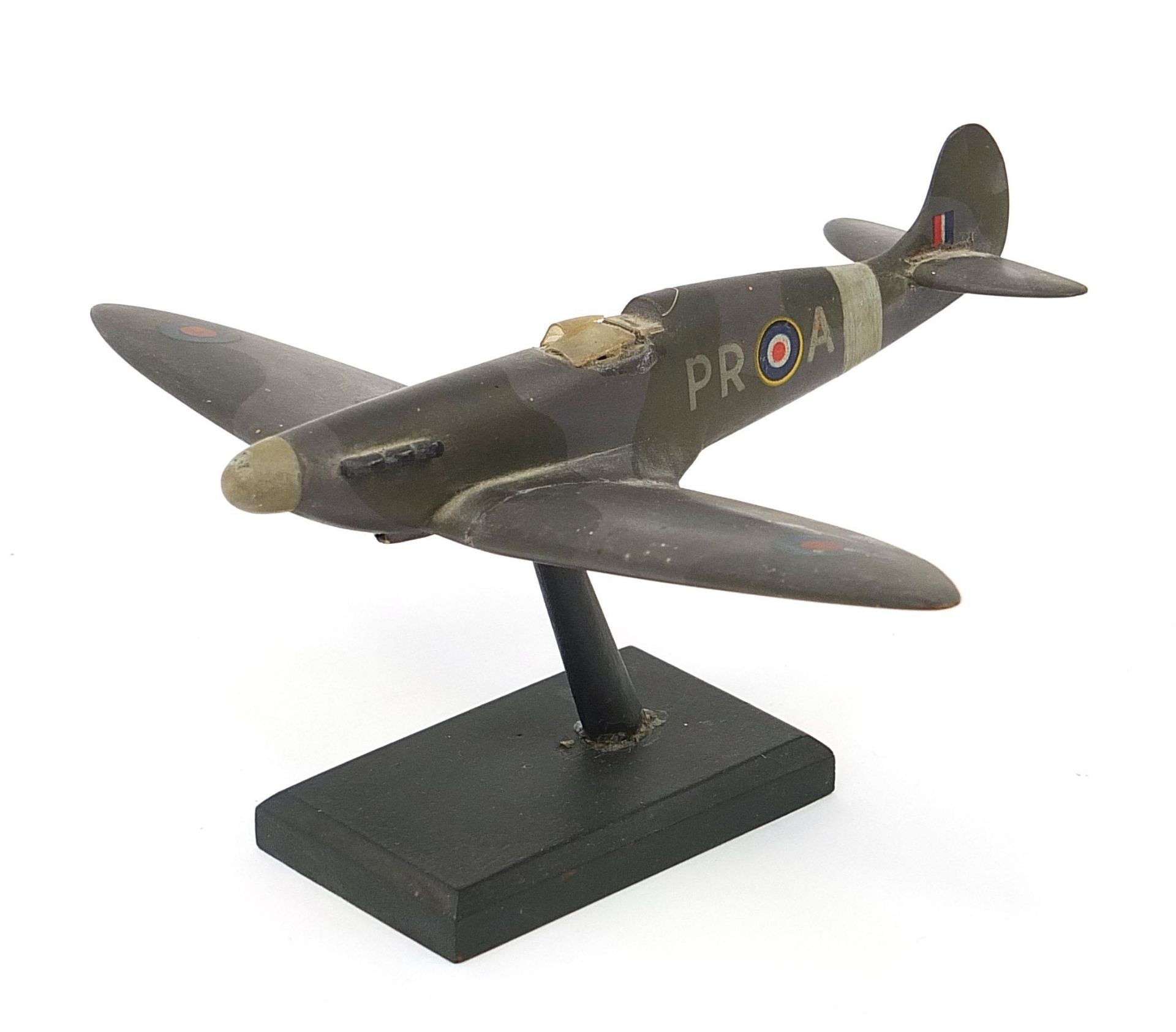 Military interest hand painted wooden model of a Spitfire, inscribed made by Flight Lieutenant Ralph