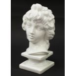 White glazed china bust on plinth of a young female, 40cm high