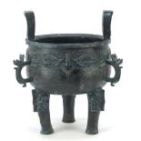Chinese bronze archaic style tripod censer having three animalia handles, 28cm high