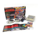 Super Nintendo Street Fighter II games console with box