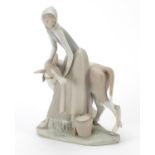 Large Lladro figure group of a female with cow having a matte glaze, 33cm high