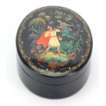Russian lacquered box and cover hand painted with mythical figures, 13cm wide