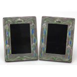Pair of Art Nouveau design sterling silver and enamel easel photo frames embossed with stylised