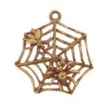 9ct gold spider web with fly pendant, 2cm high, 1.2g
